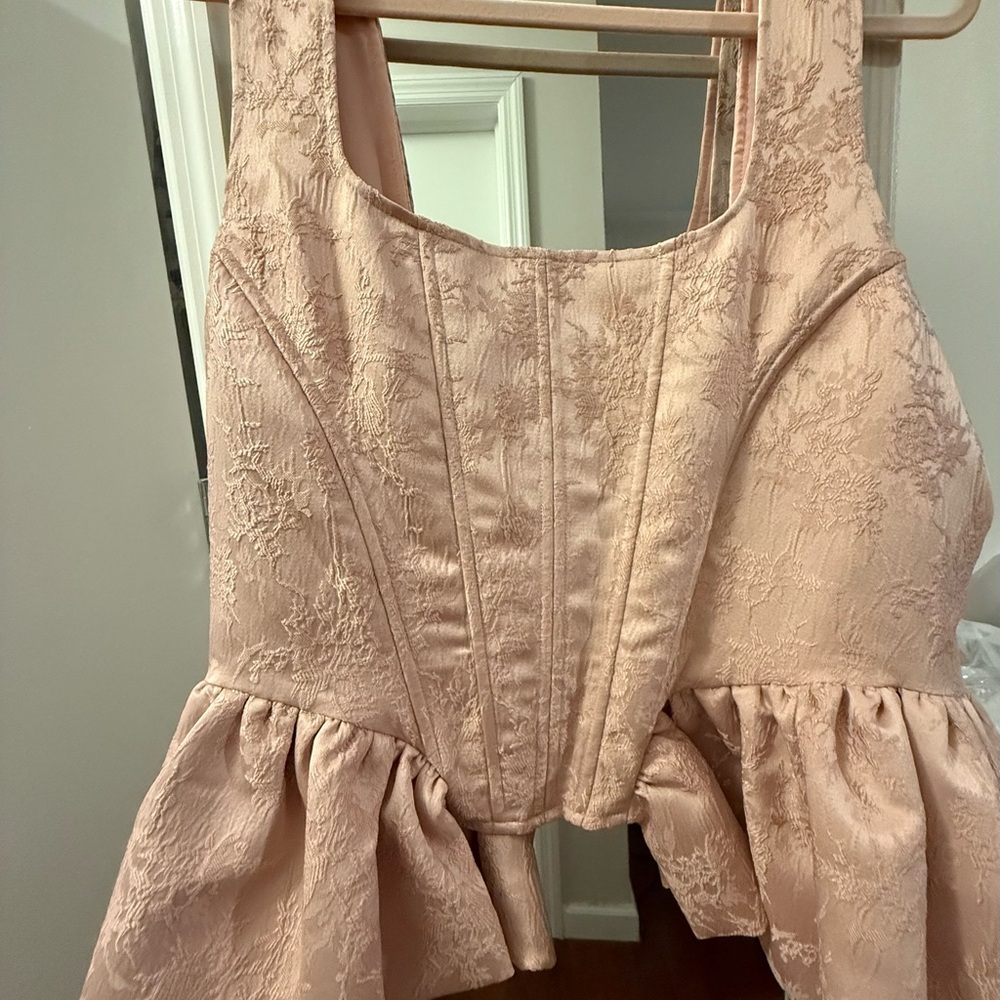 Chic Side Peplum Corset Top. Baby / light pink. New with Tags.